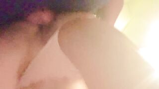 Bent over in the laundry room