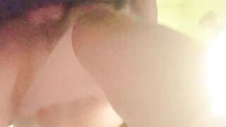 Bent over in the laundry room