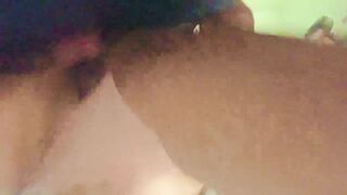 Bent over in the laundry room