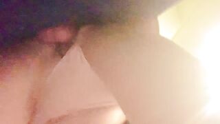 Bent over in the laundry room