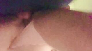 Bent over in the laundry room