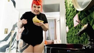 Proxy Paige playing with a banana