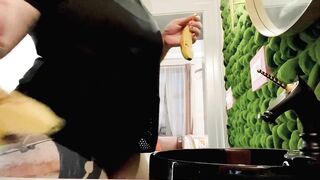 Proxy Paige playing with a banana